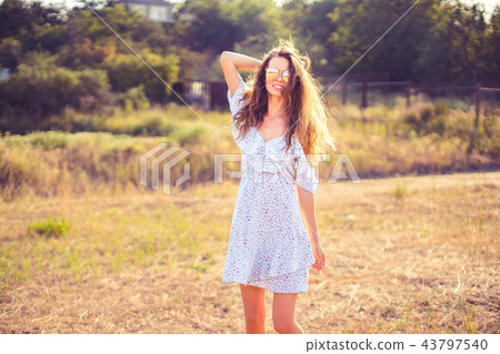 beautiful young woman outdoor on the hill on a summer day 43797540