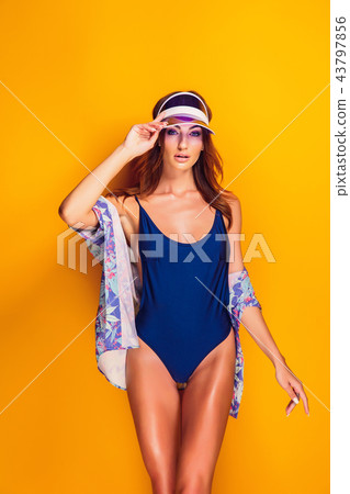 Woman in cap and swimwear Woman in cap and swimwear 43797856