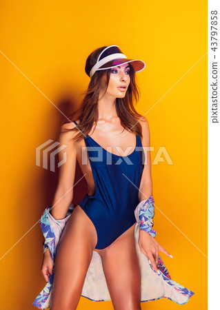 Woman in cap and swimwear Woman in cap and swimwear 43797858