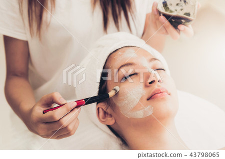 Beautiful woman having a facial treatment at spa. Beautiful woman having a facial treatment at spa. 43798065