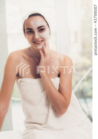 Beautiful woman having a facial treatment at spa. Beautiful woman having a facial treatment at spa. 43798087