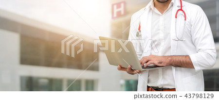 Doctor using laptop computer at the hospital. 43798129
