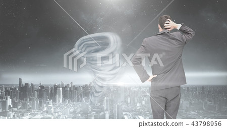 Tornado twister painted and dark city sky with businessman 43798956