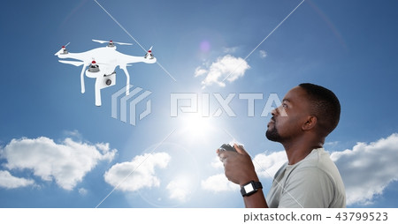 Man flying a drone in blue sky 43799523