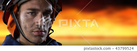 Composite image with firefighter with fire background 43799524