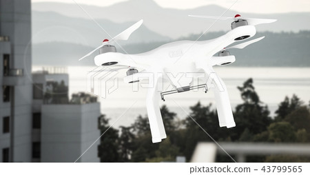 Drone flying by mountain building 43799565