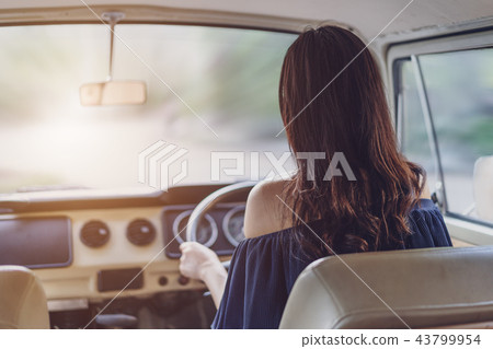 woman driving a vintage car woman driving a vintage car 43799954