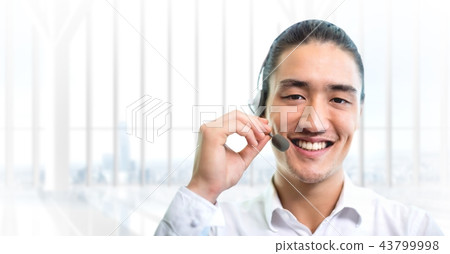 Customer service man with bright background in call center 43799998