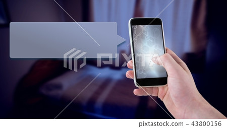 Messaging App on phone in hand with bedroom 43800156