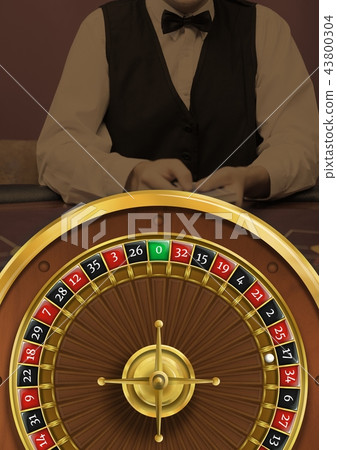 Roulette wheel and croupier in casino 43800304