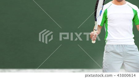 Tennis player with green background with racket 43800614