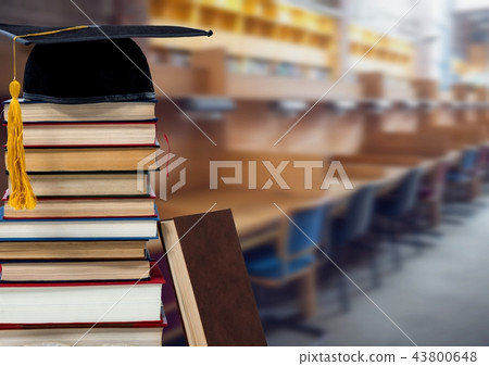 Books and graduation hat in education library 43800648