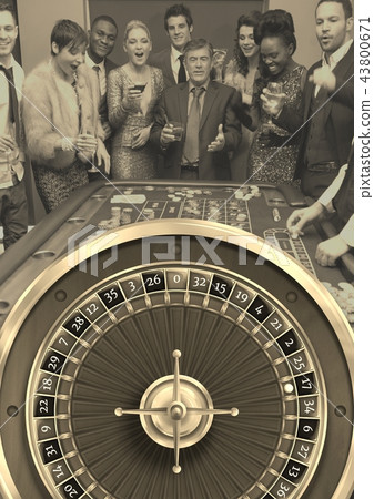 Group of people playing casino roulette game 43800671