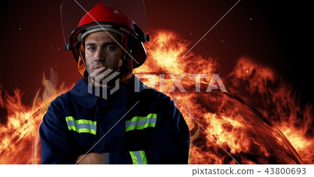Firefighter in front of burning fire Firefighter in front of burning fire 43800693