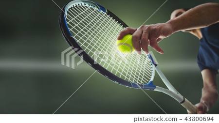 Tennis player with green background with racket 43800694