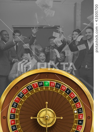 Roulette wheel with group of people celebrating Roulette wheel with group of people celebrating 43800700