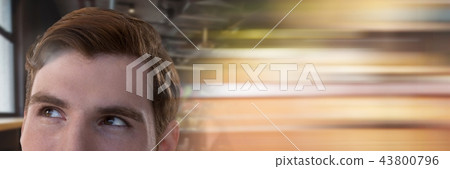 Businessman looking up by window with motion blur 43800796