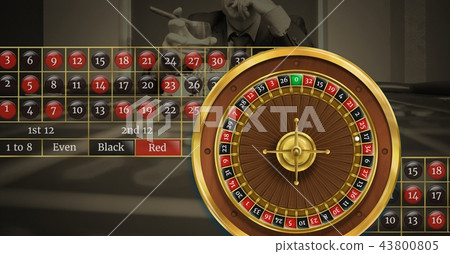 Roulette wheel and table numbers in front of casino background 43800805