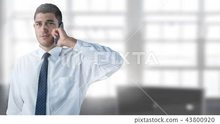 Businessman on phone in office Businessman on phone in office 43800920