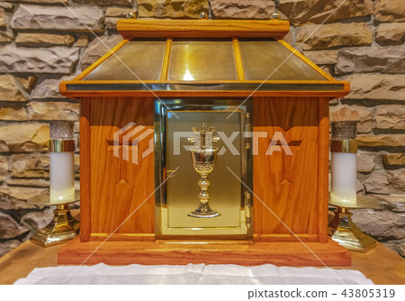 Donation box close up with crosses and gold 43805319