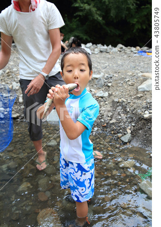 Children enjoying fishing Children enjoying fishing 43805749