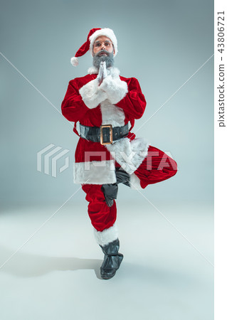 Funny guy in christmas hat. New Year Holiday. Christmas, x-mas, winter, gifts concept. Funny guy in christmas hat. New Year Holiday. Christmas, x-mas, winter, gifts concept. 43806721