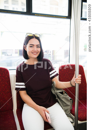 Summer Travel. Portrait Of Happy Smiling Girl In Stylish Sunglasses travelling by bus. Summer Travel. Portrait Of Happy Smiling Girl In Stylish Sunglasses travelling by bus. 43808809
