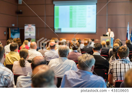 Business speaker giving a talk at business conference event. Business speaker giving a talk at business conference event. 43810605