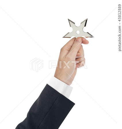 Hand is throwing ninja shuriken 43812889