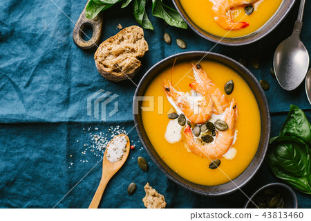 Autumn pumpkin creamy soup in bowls Autumn pumpkin creamy soup in bowls 43813460