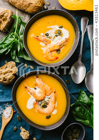 Autumn pumpkin creamy soup in bowls Autumn pumpkin creamy soup in bowls 43813461