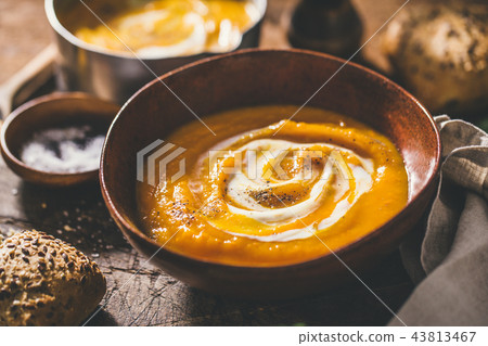 Autumn pumpkin creamy soup in bowls Autumn pumpkin creamy soup in bowls 43813467