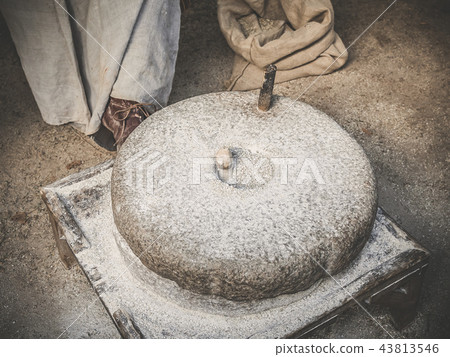 The ancient quern stone hand mill.  43813546