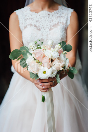 closeup of bride hands holding beautiful wedding bouquet closeup of bride hands holding beautiful wedding bouquet 43813748