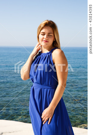 Woman in blue dress Woman in blue dress 43814393