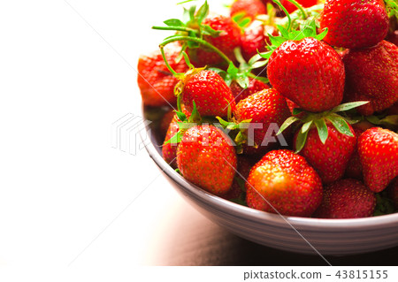fresh strawberries in a blue plate on background fresh strawberries in a blue plate on background 43815155