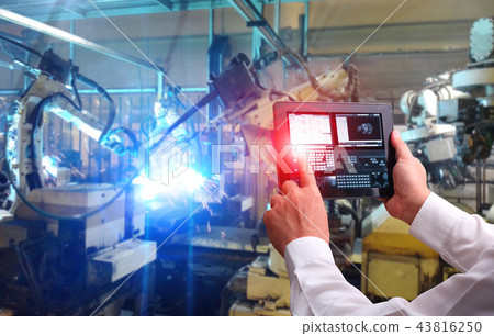 Engineer hand using tablet with machine real time Engineer hand using tablet with machine real time 43816250