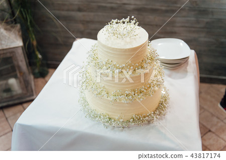 wedding cake three floors outside in the evening 43817174