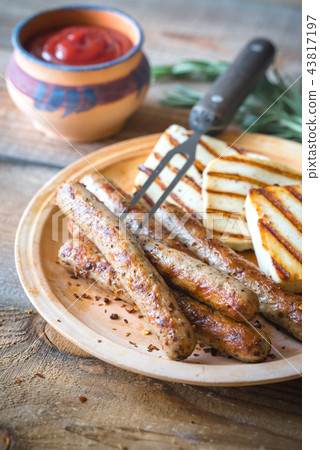 Grilled sausages and cheese with rosemary Grilled sausages and cheese with rosemary 43817197