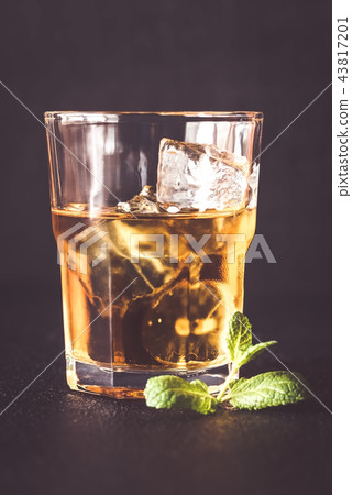 Glass of rum on the dark background 43817201