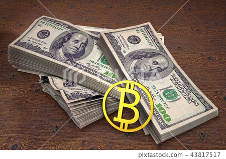 Gold bitcoin coin on background of hundred dollar banknotes on table. High quality 3D render Gold bitcoin coin on background of hundred dollar banknotes on table. High quality 3D render 43817517