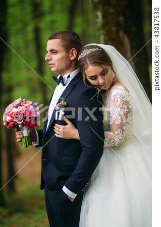 Romantic couple of newlyweds in the middle of forest 43817538