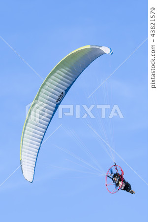 Motor paraglider Paramotor Blue sky Motor paraglider Paramotor Blue sky 43821579