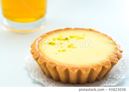 One single lemon tart, isolated on white. One single lemon tart, isolated on white. 43823036
