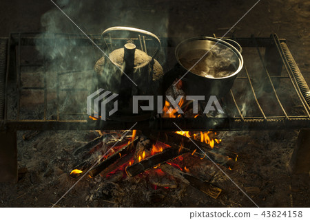 a pot and a kettle on a portable hearth a pot and a kettle on a portable hearth 43824158