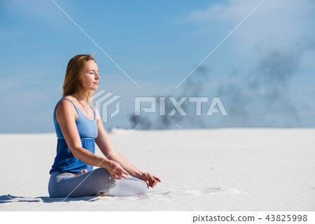 Peaceful woman sit in lotus yoga pose Peaceful woman sit in lotus yoga pose 43825998