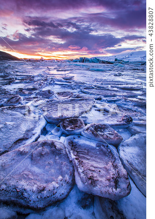 Icebergs in Jokulsarlon glacial lake during sunset, Iceland Icebergs in Jokulsarlon glacial lake during sunset, Iceland 43828807