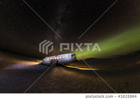 Solheimasandur plane wreck with active norhtern lights, Iceland. 43828864