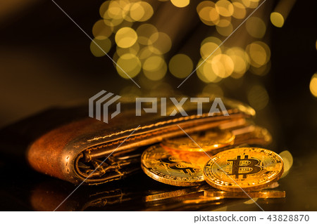 Bitcoin gold coins with wallet. Virtual cryptocurrency concept. Bitcoin gold coins with wallet. Virtual cryptocurrency concept. 43828870