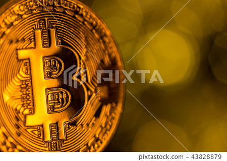 Bitcoin gold coins with defocused abstract background. Virtual cryptocurrency concept. 43828879